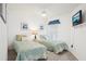 This guest bedroom is furnished with two twin beds, ceiling fan and closet at 732 Ramirez Ave, The Villages, FL 32159