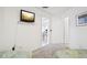This bedroom offers carpeting, a TV and easy access to other rooms in the house at 732 Ramirez Ave, The Villages, FL 32159
