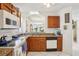 The kitchen features granite countertops and an arched opening to an adjacent living space at 732 Ramirez Ave, The Villages, FL 32159