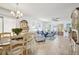 Bright living room featuring comfortable seating, stylish decor, and tile floors at 732 Ramirez Ave, The Villages, FL 32159