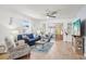 Bright living room featuring comfortable seating, stylish decor, and tile floors at 732 Ramirez Ave, The Villages, FL 32159