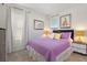 Cozy bedroom with a comfortable bed, soft lighting, and charming decor at 8024 Oak Shadow Ct, Davenport, FL 33837