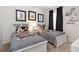 Charming bedroom with twin beds and fun Mickey Mouse themed decor at 8024 Oak Shadow Ct, Davenport, FL 33837