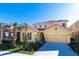 Inviting two-story home featuring a red tile roof and attached two car garage at 8024 Oak Shadow Ct, Davenport, FL 33837