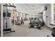 Spacious community gym with modern exercise equipment and abundant natural light at 8024 Oak Shadow Ct, Davenport, FL 33837
