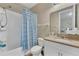 Clean and functional bathroom with a tub and shower combination and a neutral color palette at 8272 Procida Isle Ln, Windermere, FL 34786