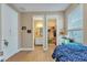 Bedroom with ensuite bathroom, closet, and a fish tank near the window with natural light at 8272 Procida Isle Ln, Windermere, FL 34786