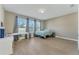 Spacious bedroom with tiled flooring, large windows, and a comfortable workspace area at 8272 Procida Isle Ln, Windermere, FL 34786