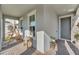 Inviting front porch features a porch swing and ample space for outdoor relaxation at 8272 Procida Isle Ln, Windermere, FL 34786