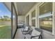 Relaxing screened patio with comfortable seating and a view of the landscaped backyard at 8272 Procida Isle Ln, Windermere, FL 34786