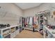 Organized walk-in closet with wire shelving and storage, providing ample space for clothes and accessories at 8272 Procida Isle Ln, Windermere, FL 34786