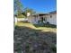 Spacious backyard with covered patio, perfect for outdoor entertaining and relaxation with the covered patio and fence at 879 Little Bend Rd, Altamonte Springs, FL 32714