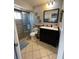 Bathroom features updated vanity with black hardware and tiled walk-in shower at 879 Little Bend Rd, Altamonte Springs, FL 32714
