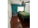 Cozy bedroom with hardwood floors, ceiling fan and natural light at 879 Little Bend Rd, Altamonte Springs, FL 32714