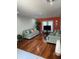 Cozy living room with hardwood floors, two sofas, and plenty of natural light from the windows at 879 Little Bend Rd, Altamonte Springs, FL 32714