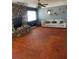 Inviting living room features stone fireplace, ceiling fan, and large window for natural light and comfort at 879 Little Bend Rd, Altamonte Springs, FL 32714