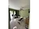 Versatile room with exercise equipment, office area, and large windows at 879 Little Bend Rd, Altamonte Springs, FL 32714