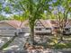 Aerial view of a charming single-story home featuring a brick facade and an attached two-car garage at 8814 Sw 93Rd Ln # B, Ocala, FL 34481