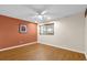 Cozy bedroom with wood floors, neutral walls, and natural light from a window at 8814 Sw 93Rd Ln # B, Ocala, FL 34481