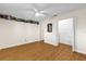 Bright bedroom features a ceiling fan, wood-look flooring, and closet for ample storage at 8814 Sw 93Rd Ln # B, Ocala, FL 34481