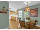 Cozy dining area featuring a glass table and charming wicker chairs near the kitchen at 8814 Sw 93Rd Ln # B, Ocala, FL 34481
