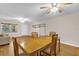 Bright dining room features wood floors, ceiling fan, and natural light from a large window at 8814 Sw 93Rd Ln # B, Ocala, FL 34481