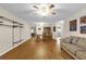 Open concept living room and dining room featuring a ceiling fan and laminated floors at 8814 Sw 93Rd Ln # B, Ocala, FL 34481
