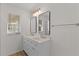 Bathroom boasts a dual sink vanity and stylish fixtures at 909 Cajon Ct, The Villages, FL 32159