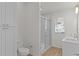 Bathroom boasts a tiled shower, dual sinks, and modern fixtures at 909 Cajon Ct, The Villages, FL 32159