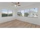 Light and airy bedroom with large windows showcasing the exterior, creating a serene living space at 909 Cajon Ct, The Villages, FL 32159