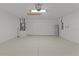 Spacious garage with an epoxy floor and a water heater at 909 Cajon Ct, The Villages, FL 32159