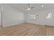 Bright living room boasts updated floors, ceiling fan, and a welcoming front door at 909 Cajon Ct, The Villages, FL 32159