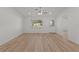 Well-lit living area with light-colored walls and flooring, showcasing a welcoming front entryway at 909 Cajon Ct, The Villages, FL 32159