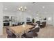 Bright, open-concept living area with modern furnishings and updated kitchen, perfect for entertaining at 909 Cajon Ct, The Villages, FL 32159