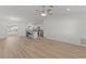 An open-concept living area with new floors leading into an eat-in kitchen, excellent for hosting guests at 909 Cajon Ct, The Villages, FL 32159