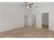 Spacious main bedroom with an ensuite bathroom, walk-in closet, and new floors at 909 Cajon Ct, The Villages, FL 32159