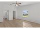 Spacious main bedroom with an ensuite bathroom, walk-in closet, and new floors at 909 Cajon Ct, The Villages, FL 32159