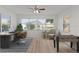 Inviting home office with large windows, wood floors, and dedicated workspace, perfect for remote work at 909 Cajon Ct, The Villages, FL 32159