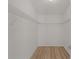 Spacious walk-in closet features shelving for optimal storage and organization at 909 Cajon Ct, The Villages, FL 32159