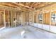 Interior view showcases the home's wooden framework and concrete slab ready for customization at Lot 3 Indian Estates Cr 423, Lake Panasoffkee, FL 33538