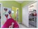 Colorful bedroom with a closet, whimsical art, and an adjacent bathroom at 1111 Myrtle Breezes Ct, Fruitland Park, FL 34731