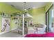 Fun bedroom features a loft bed, cozy seating, and creative wall decor at 1111 Myrtle Breezes Ct, Fruitland Park, FL 34731