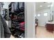 Organized walk-in closet features built-in shelving and drawer systems in addition to a vanity at 1111 Myrtle Breezes Ct, Fruitland Park, FL 34731
