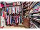 Large closet has abundant storage with shelves, drawers and rods for organized wardrobe at 1111 Myrtle Breezes Ct, Fruitland Park, FL 34731
