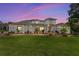 Beautiful home features a manicured lawn, well-maintained landscaping, and a modern architectural style at twilight at 1111 Myrtle Breezes Ct, Fruitland Park, FL 34731