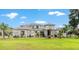 Beautiful home features a manicured lawn, well-maintained landscaping, and a modern architectural style at 1111 Myrtle Breezes Ct, Fruitland Park, FL 34731