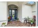 Inviting entryway with brick walkway, stylish door, and well-maintained landscaping at 1111 Myrtle Breezes Ct, Fruitland Park, FL 34731
