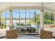 Luxury outdoor lanai with a tranquil pool, spa, and beautiful lake views, perfect for relaxation at 1111 Myrtle Breezes Ct, Fruitland Park, FL 34731