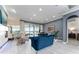 Beautiful living room with natural light, tiled floors, and elegant furnishings at 1111 Myrtle Breezes Ct, Fruitland Park, FL 34731