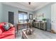 Cozy living room featuring water views, art accents, and comfortable seating for relaxing at home at 1111 Myrtle Breezes Ct, Fruitland Park, FL 34731